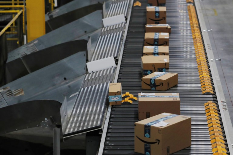 Amazon packages are pushed onto ramps leading to delivery trucks by a robotic system as they travel on conveyor belts inside of an Amazon fulfillment center on Cyber Monday in Robbinsville, New Jersey, U.S., December 2, 2019. REUTERS/Lucas Jackson Amazon packages are pushed onto ramps leading to delivery trucks by a robotic system as they travel on conveyor belts inside of an Amazon fulfillment center on Cyber Monday in Robbinsville, New Jersey